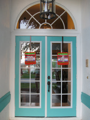 We decorated the doors with colorful signs for the party. 