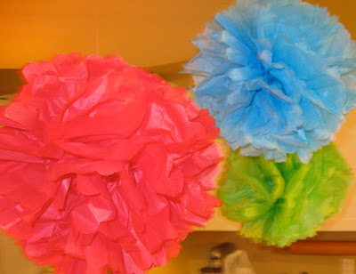 These DIY tissue paper party puffs are easy to hang and are inexpensive to make. 