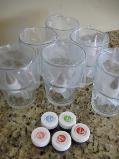 Assemble the bags and food coloring over cups to hold them open. 
