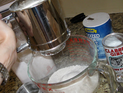 Sifting the dry ingredients for the best ever sugar cookies!