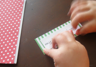 Glue the label onto the festive coloring book. 