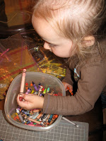 Playing with crayons is fun for toddlers to do. 