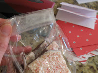 Seal plastic bag of peppermint bark and fold over.