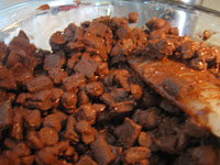 Begin melting and stirring chocolate chunks in large glass bowl. 