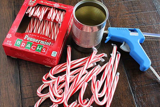 Looking for the perfect holiday centerpiece? This easy DIY candy cane vase is a budget-friendly project that will be the star of your holiday table!