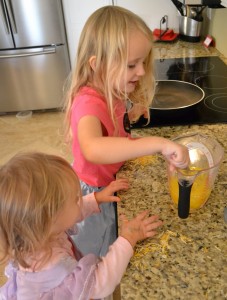 Sisters helping with cracking eggs for this best ever scrambled egg recipe. 