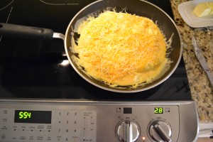 Sprinkle cheese on top of your scrambled egg mixture. 