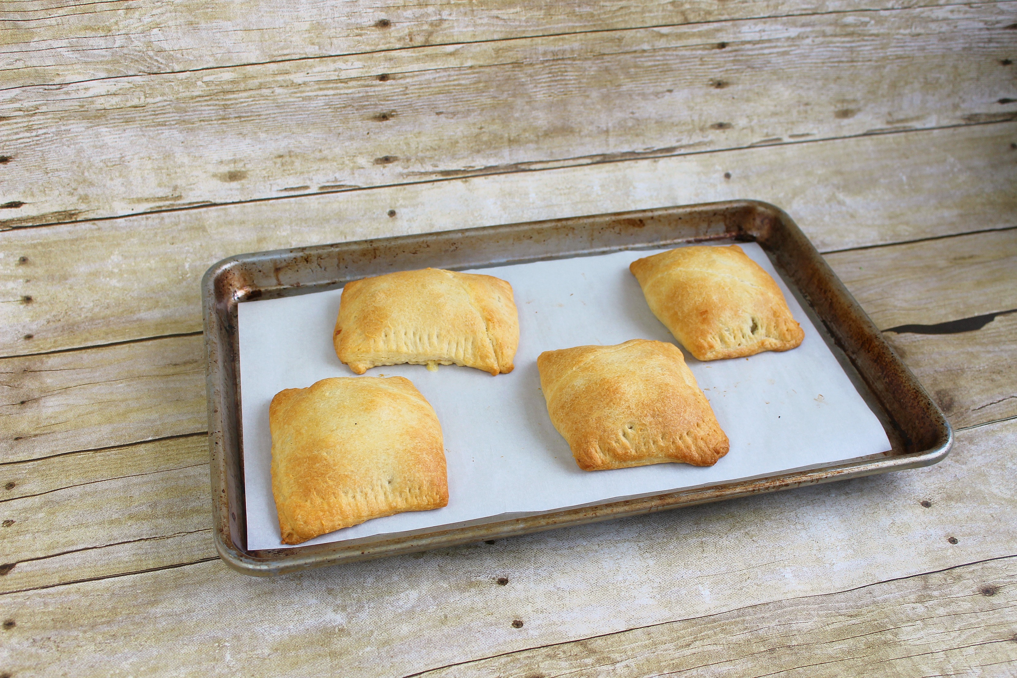 Step 7 of the Roasted Vegetable Pot Pie Pockets recipe is to bake for 20 minutes at 350 degrees and then enjoy!