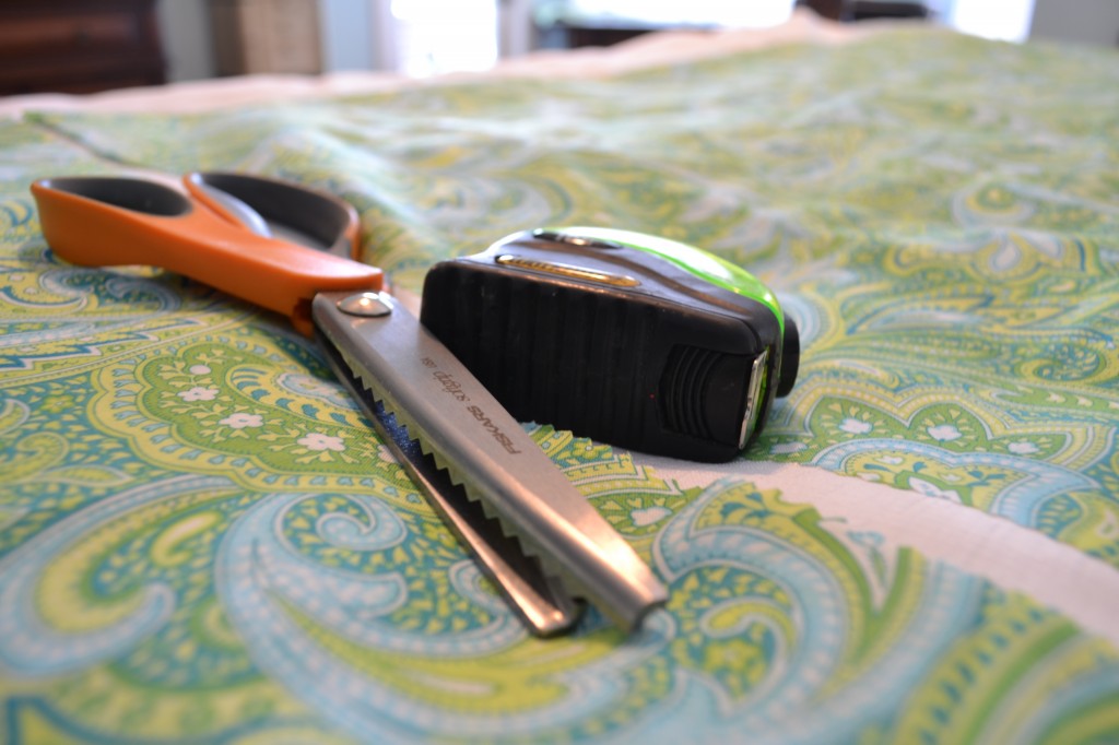 Use pinking sheers and a tape measure to trim your fabric. 