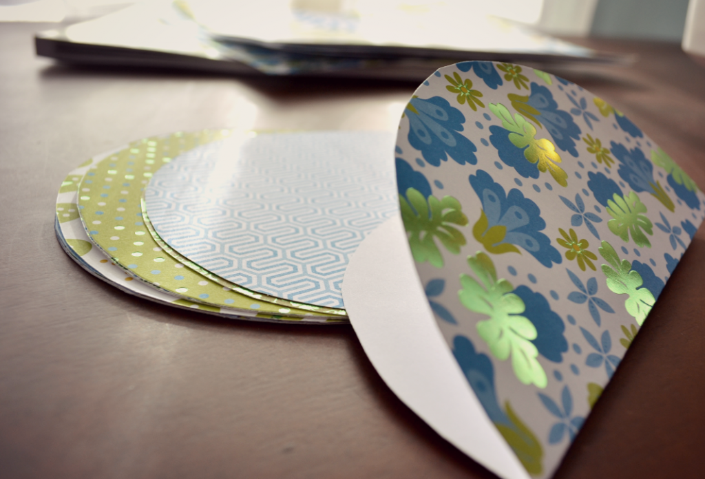 Fold each piece of cut out paper stock in half. 