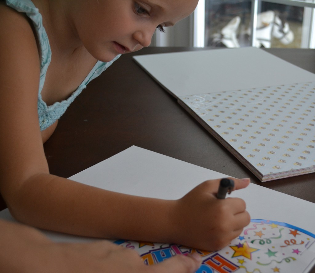 Tracing the party hats onto the back of scrapbook paper. 