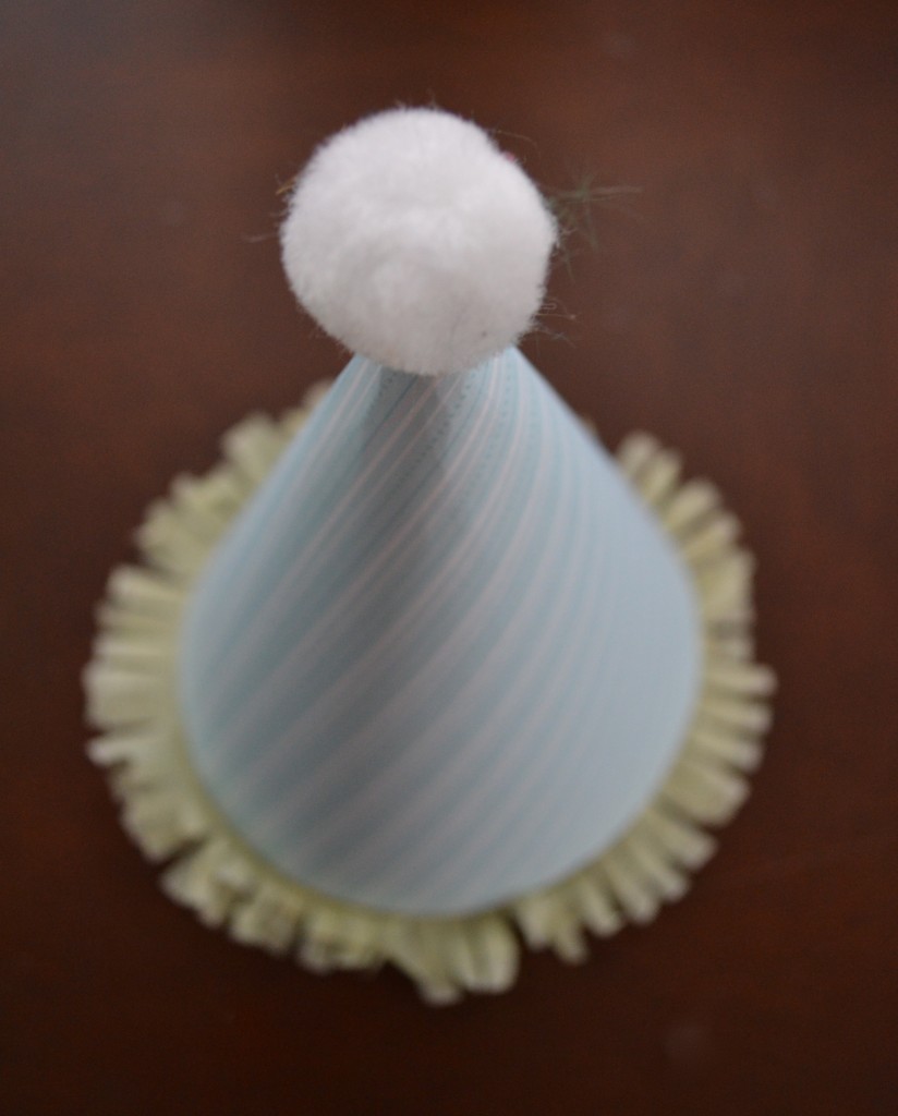 Once your hat is finished, glue a pompom to the top!