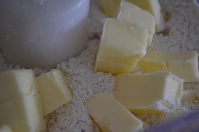 Combine your flour, salt, sugar, and chilled butter in the food processor. 