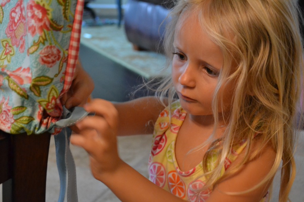 Tie your beautiful, handcrafted DIY Simple Chair Slipcover on to your chair.