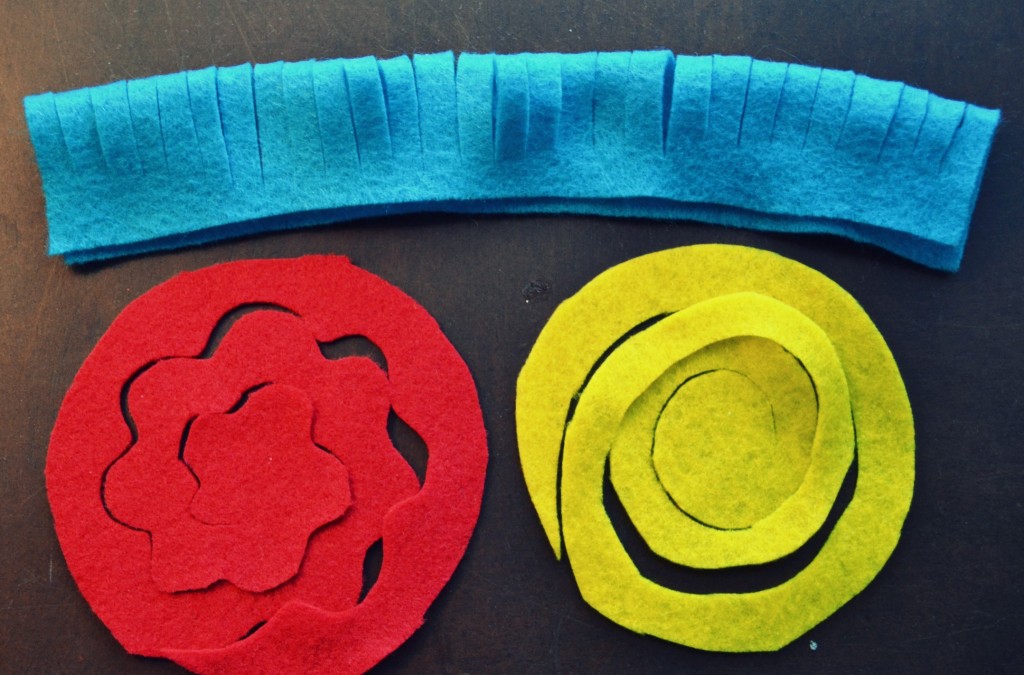 Cut your colorful felt pieces into flower shapes and circles for your hair clips. 