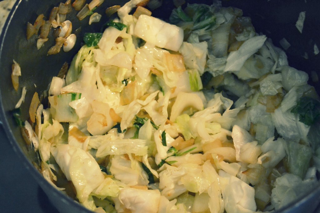 Saute vegetables in a large pot until tender. 