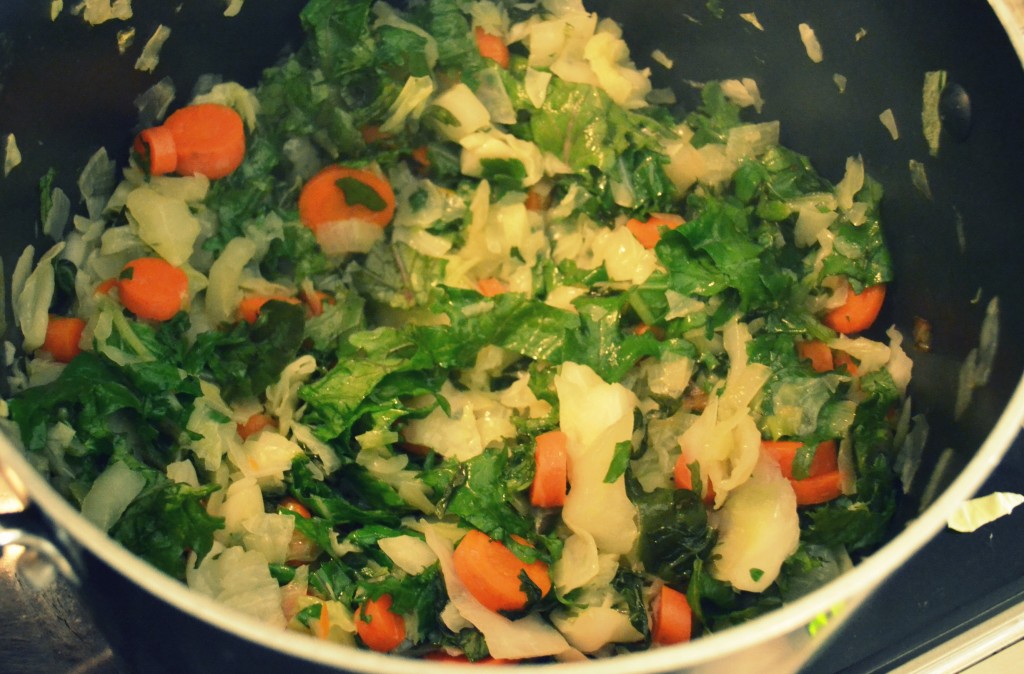 Add additional vegetables to the pot like carrots and herbs then saute. 