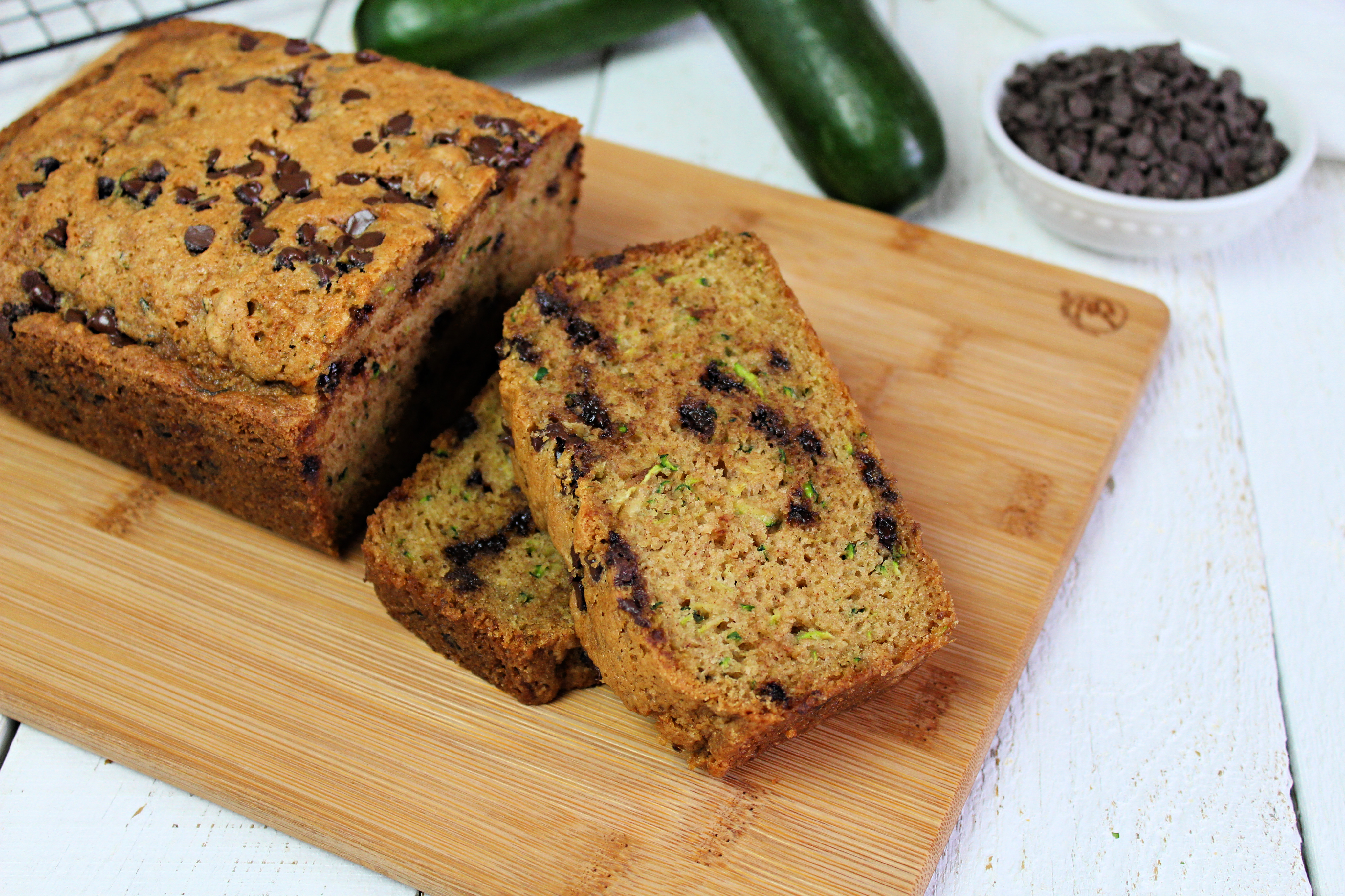 Got zucchinis? This super moist & ridiculously easy zucchini bread recipe whips up fast and makes enough to share! It also freezes beautifully!