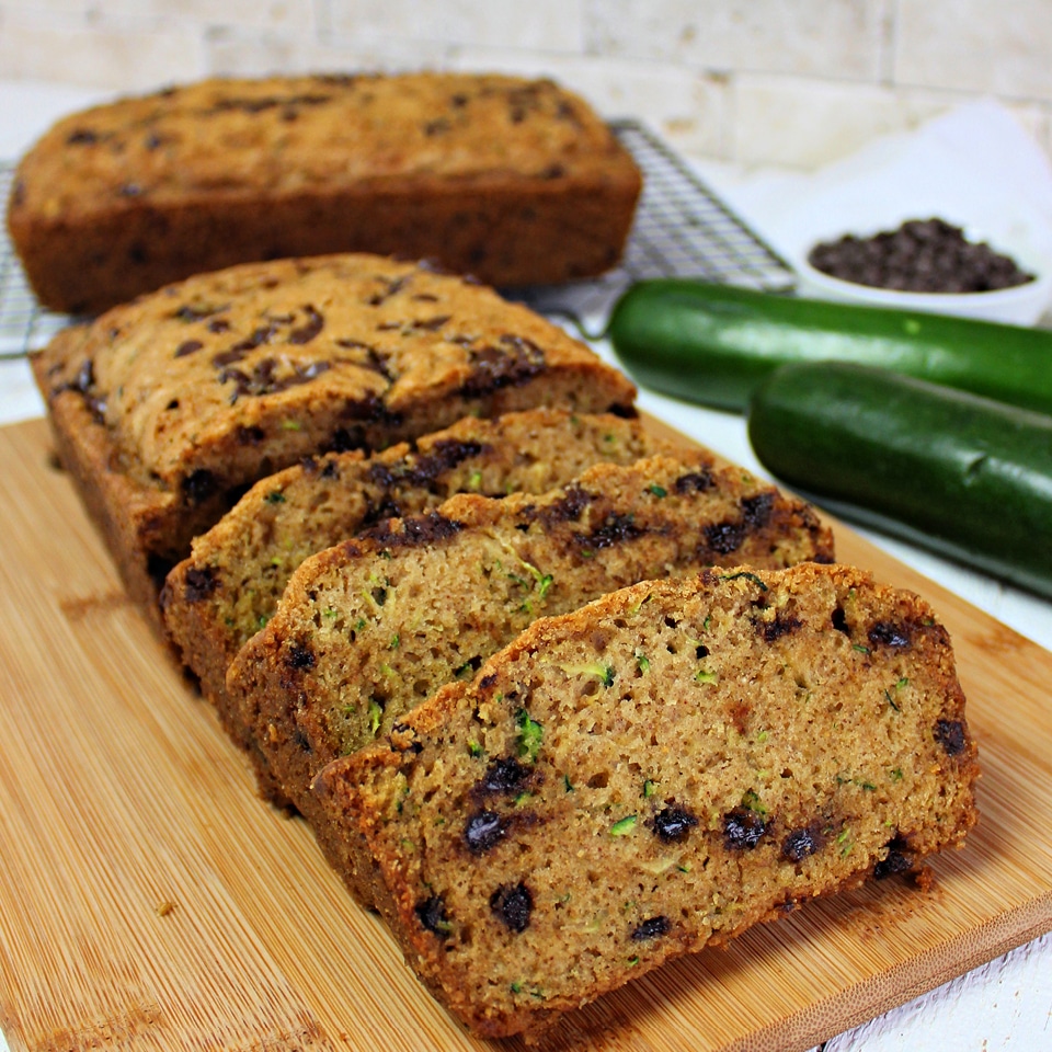 Got zucchinis? This super moist & ridiculously easy zucchini bread recipe whips up fast and makes enough to share! It also freezes beautifully!