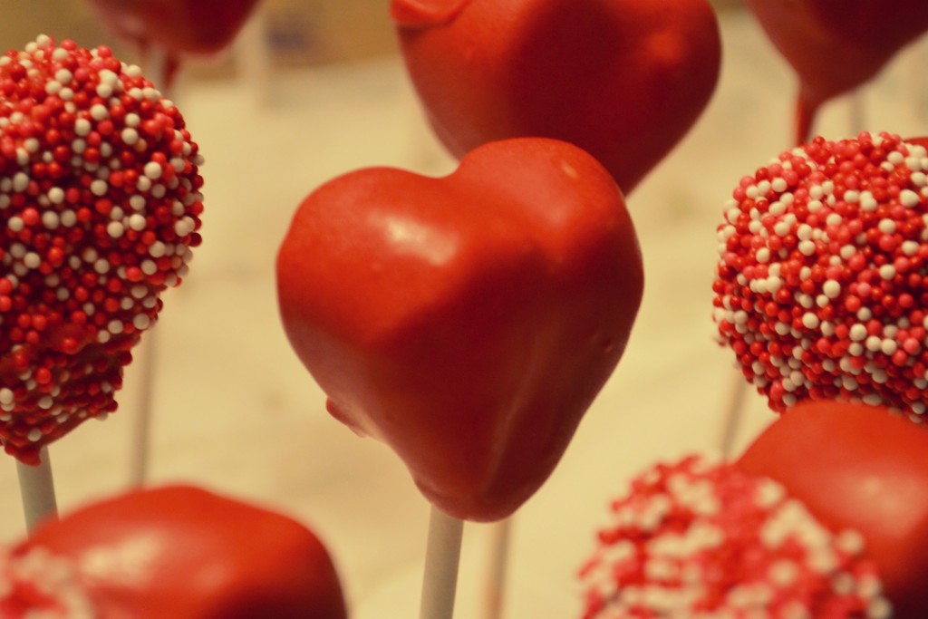 Allow candy covered heart shaped cake pops to dry. 