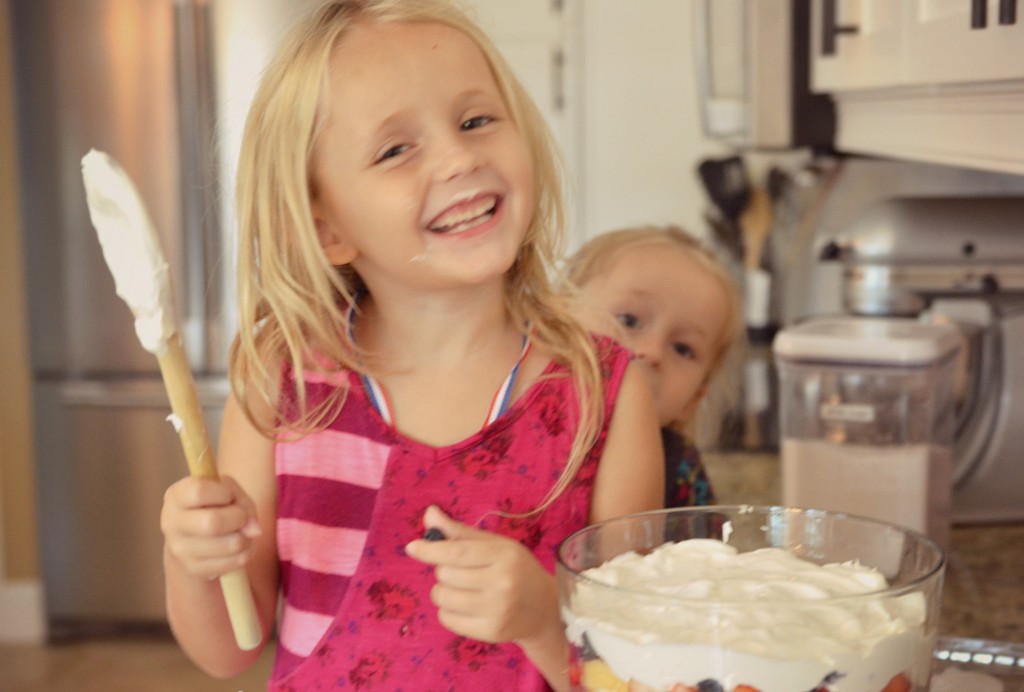 Kids will love to help add the whipped cream to the Olympic inspired dessert for the party.