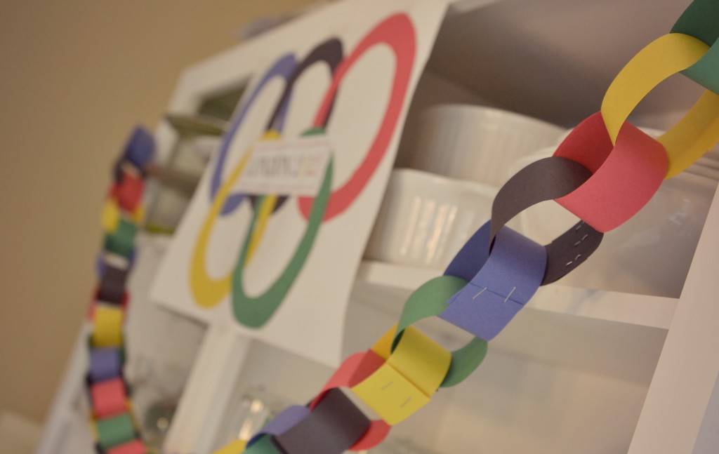 A paper chain of Olympic rings is perfect decor for a kid friendly Olympics party. 