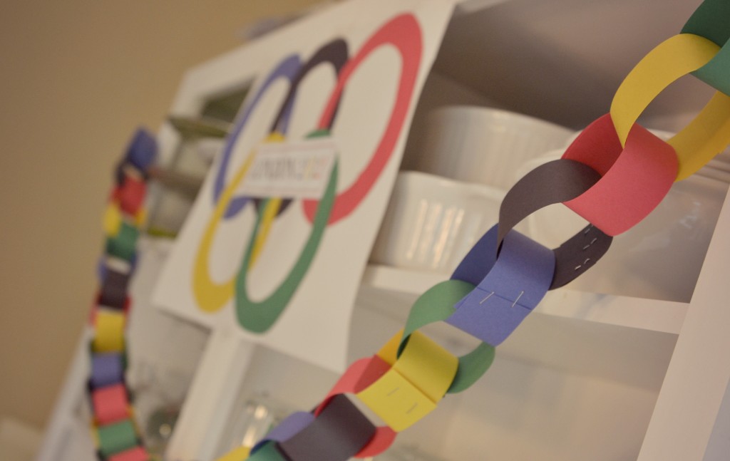 A paper chain of Olympic rings is perfect decor for a kid friendly Olympics party. 