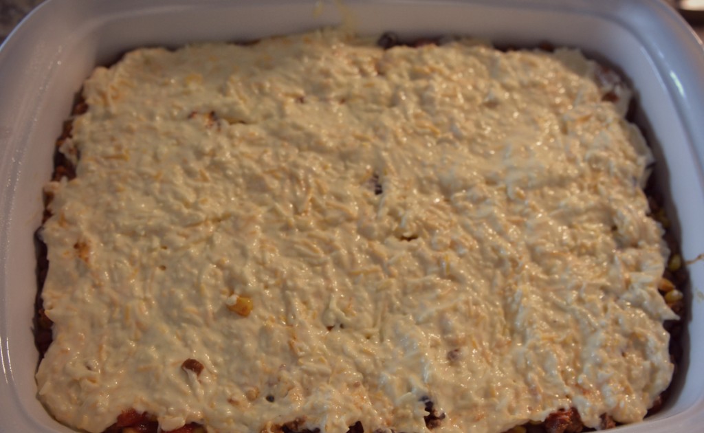 Spread out Bisquick mixture evenly over beans in casserole dish 
