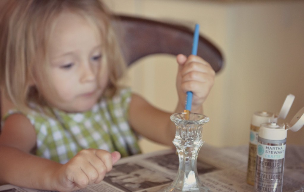 Paint your dollar store candle sticks with the Martha Stewart metallic paint. 