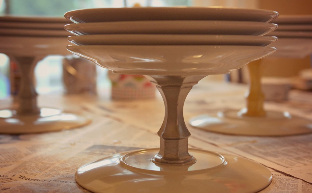 Weigh down the candlesticks with a stack of plates and let them dry.