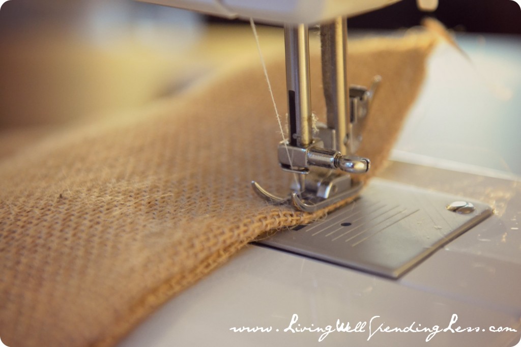 Starting at one bottom corner, sew two sides of burlap together for a few inches.