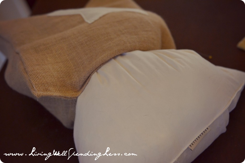 Stuff pillow insert into cover through opening.