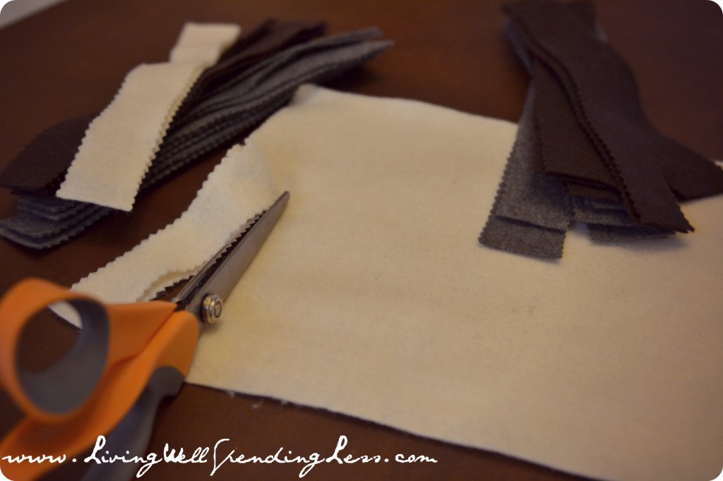 Cut strips of felt with pinking shears.