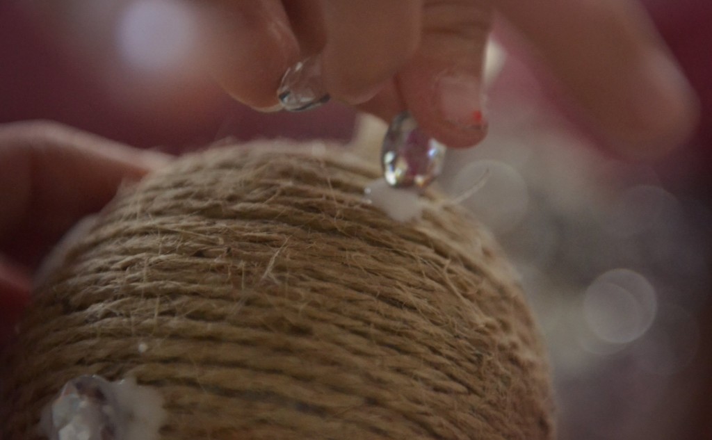 Glue gems to the twine ornaments for some added sparkle. 