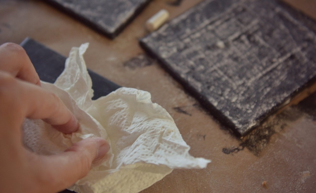 DIY Chalkboard Coaster Set | Wipe the chalkboard coasters clean with a paper towel after seasoning them. 