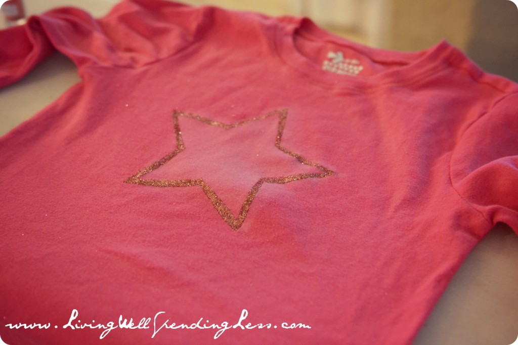 Finished glitter star shaped vintage t-shirt is ready to be worn. 