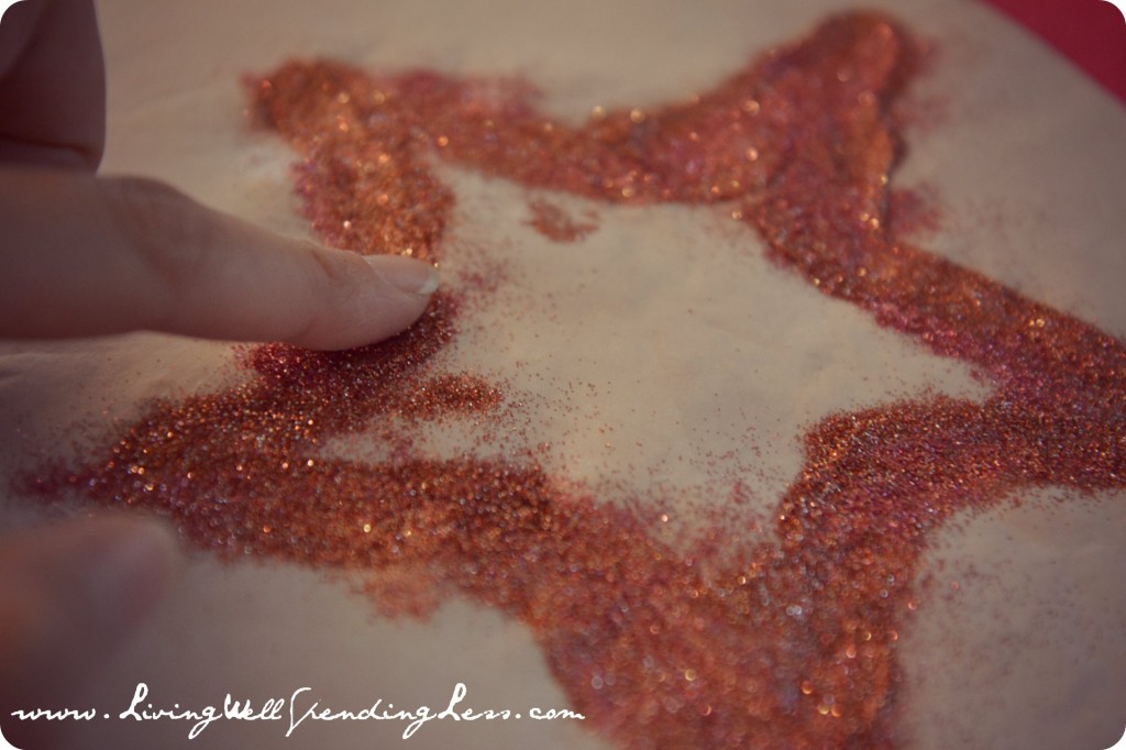 Apply glitter to outline of star shape. 