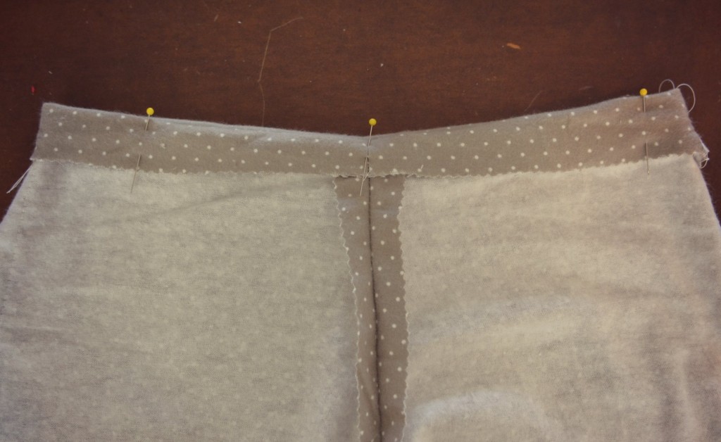 Pin along the top of the waistband of your pajama pants after folding it over. 