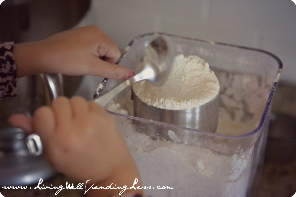 Measure out the dry ingredient you need, starting with the flour. 