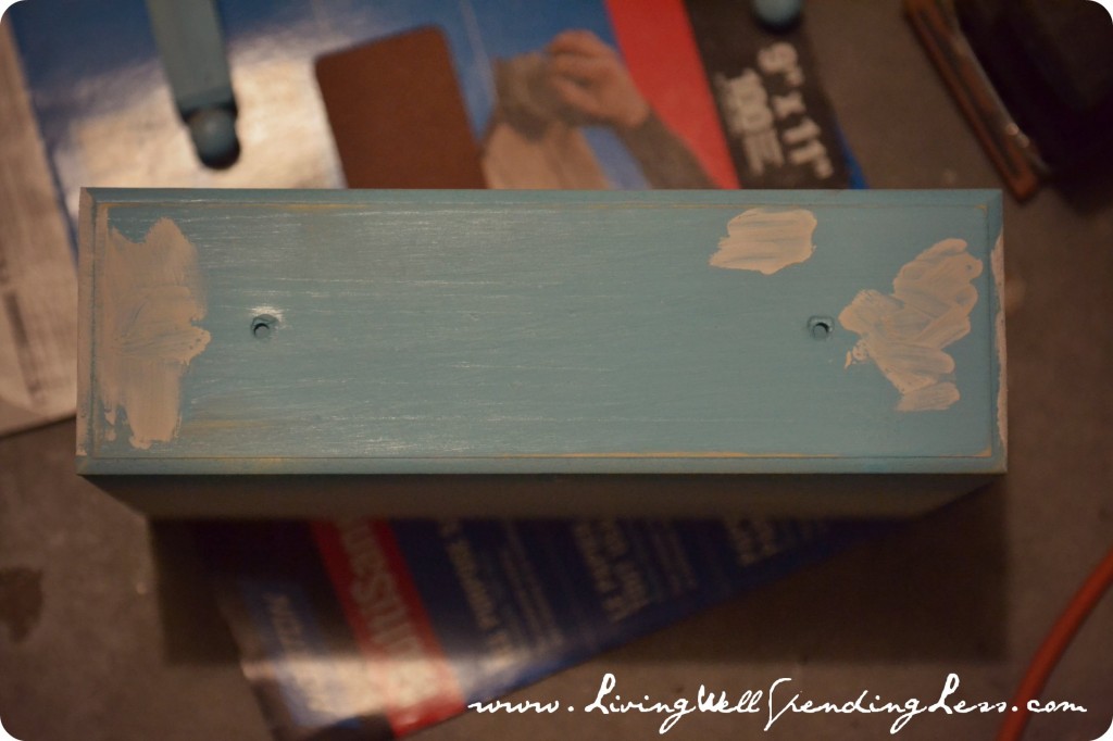 Continue sanding and painting all pieces of the doll bed and armoire.