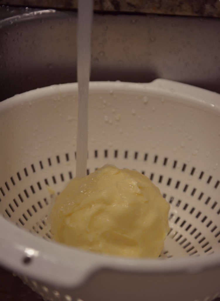 Rinse the butter under cold water in a colander in the sink. 