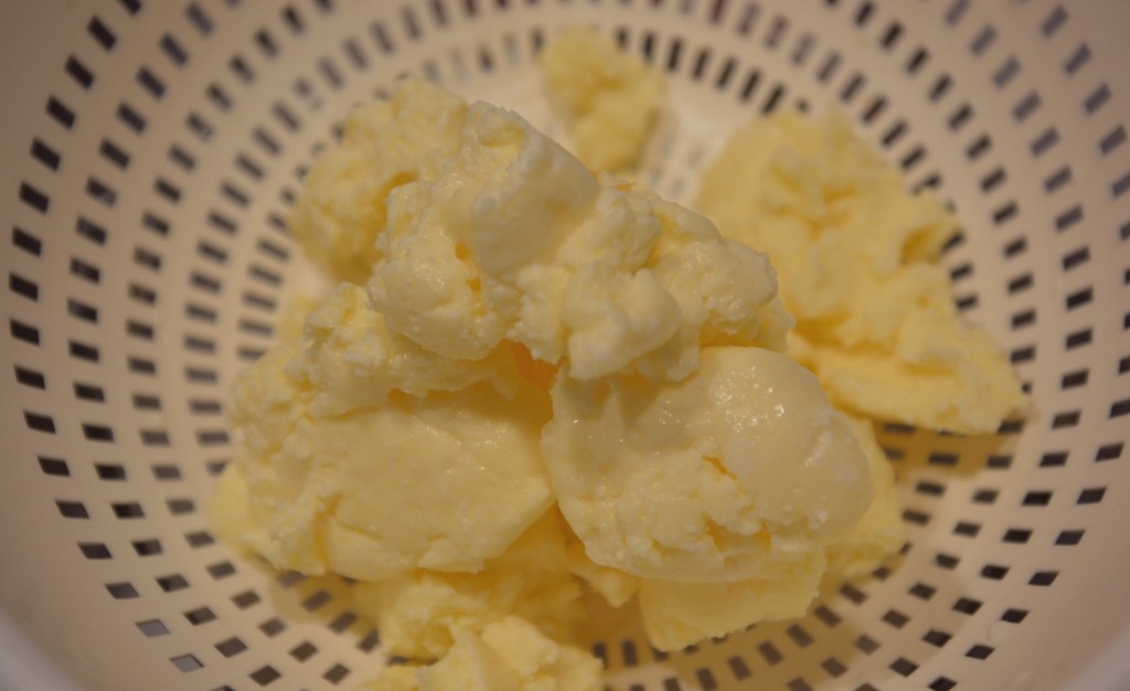 Our homemade butter draining in a colander--it's easy to make butter in a stand mixer. 