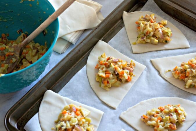 Fill dough with cooked vegetables.