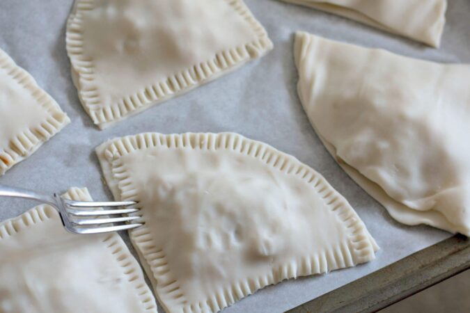 Close dough with fork