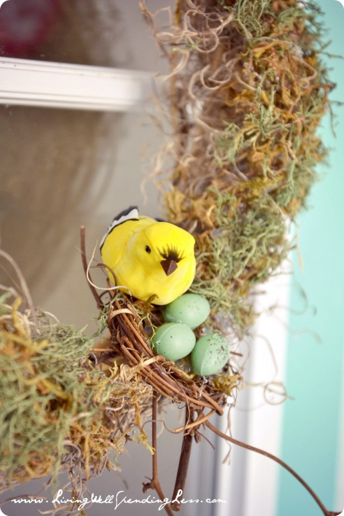 Glue eggs in place on top of moss in bird nest and finish by clipping the bird to the nest.