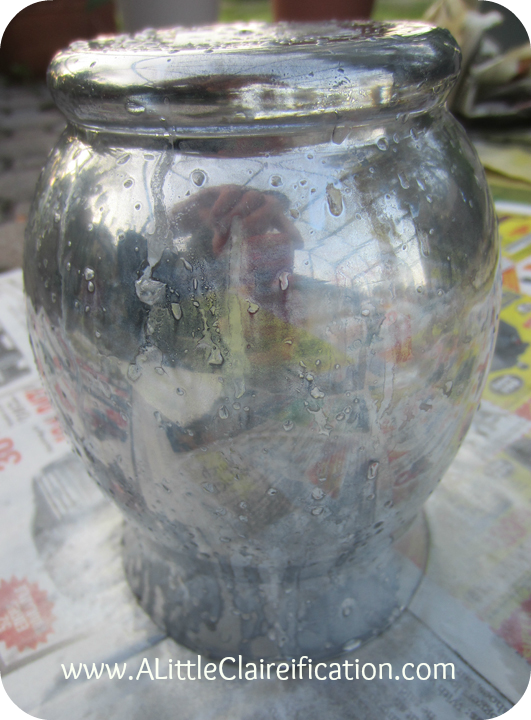 Here is the result of one coat of spray paint and vinegar solution on this DIY mercury glass vase. .