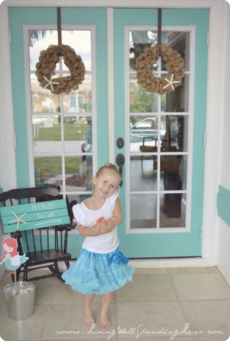 My little mermaid ready for her beachy mermaid birthday party! Here's how we created these darling decorations. 