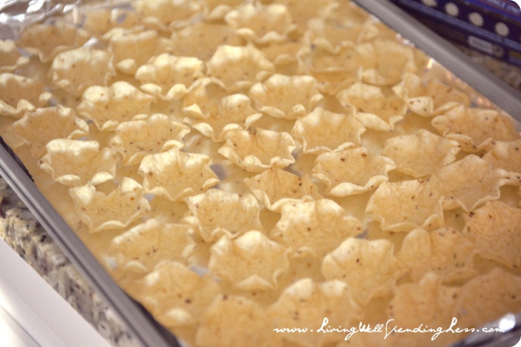 Arrange whole scoop tortilla chips on a baking sheet. 