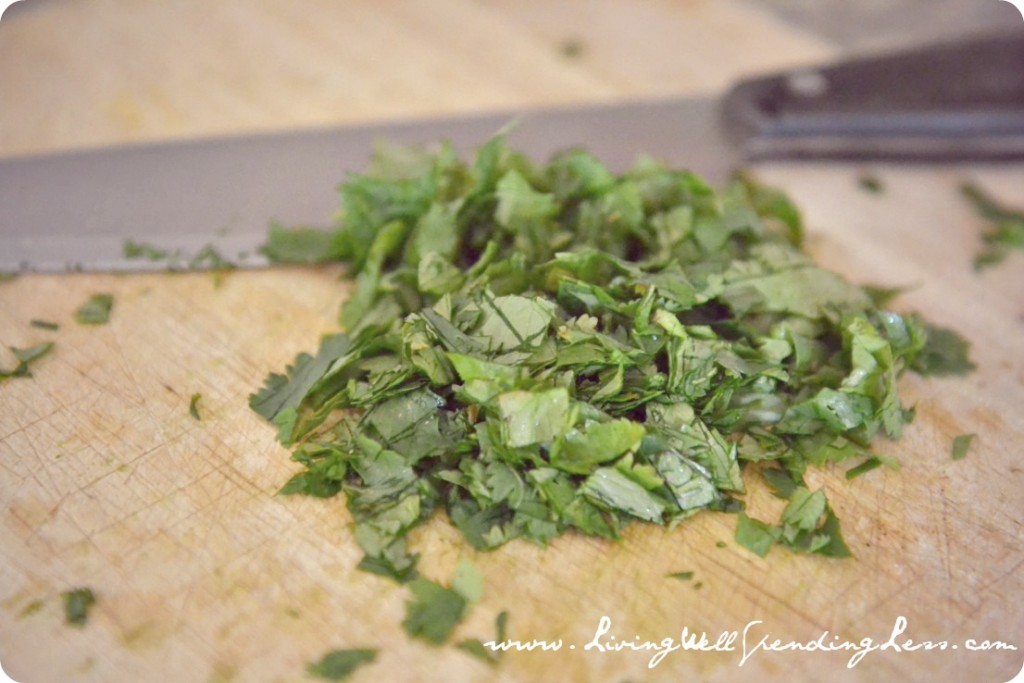 Chop cilantro to serve as a garnish on the chili
