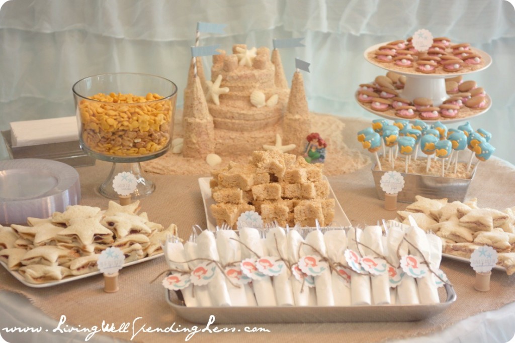 This sandcastle cake was the perfect centerpiece for my daughter's beach-themed mermaid party!